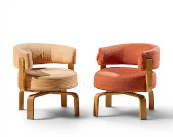 May include: Two mid-century modern swivel chairs. One chair is upholstered in a light tan fabric, and the other is in a reddish-orange textured fabric. Both chairs have wooden frames and curved backs. The chairs are set against a white background.