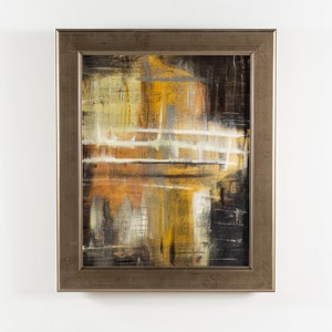 May include: Abstract painting in a silver frame. The painting features shades of brown, yellow, and white with a layered, textured effect.