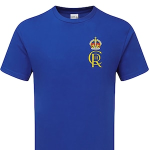 May include: Royal blue t-shirt with a gold embroidered crown and the letters "C R III" on the left chest.