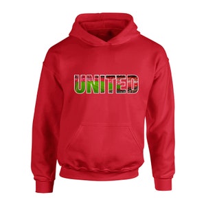 May include: Red hooded sweatshirt with the word "UNITED" printed on the front. The letters are made up of a stadium image.