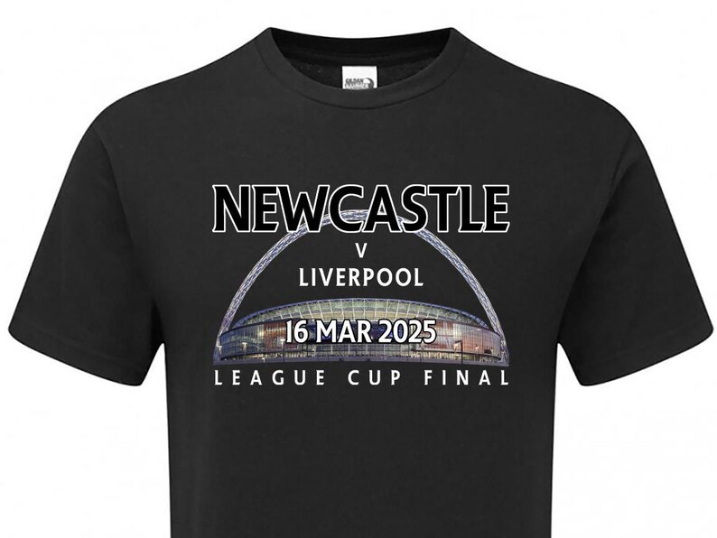 May include: Black t-shirt with white text that reads "NEWCASTLE v LIVERPOOL 16 MAR 2025 LEAGUE CUP FINAL". The text is over a photo of a stadium.