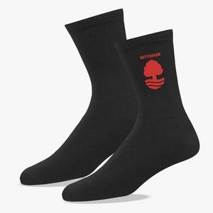 May include: A pair of black crew socks. The right sock features the word "NOTTINGHAM" in red above a red tree and wave logo. The socks are made of a soft, comfortable material.