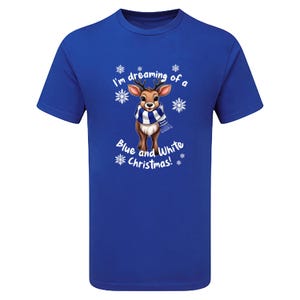May include: Royal blue t-shirt featuring a cartoon reindeer wearing a blue and white scarf, surrounded by snowflakes. The text "I'm dreaming of a Blue and White Christmas!" is printed on the shirt.