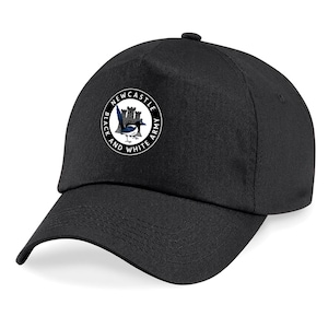 May include: Black baseball cap with a white circle logo featuring a black and white magpie, a castle, and the text "Newcastle Black and White Army".