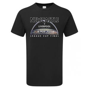 May include: Black t-shirt with white text that reads "NEWCASTLE v LIVERPOOL 16 MAR 2025 LEAGUE CUP FINAL". The text is arched over a photo of a stadium.