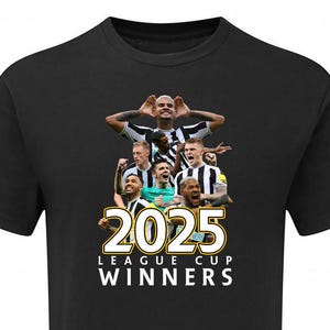 May include: Black t-shirt with a group of soccer players in black and white uniforms celebrating. The text "2025 LEAGUE CUP WINNERS" is printed in gold on the shirt.