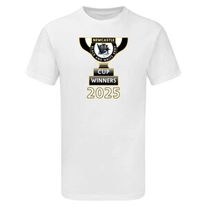 May include: White t-shirt with a gold and black trophy design. The trophy has the text "Newcastle" and "Black and White Army" with a castle graphic. Below the trophy is "Cup Winners 2025".