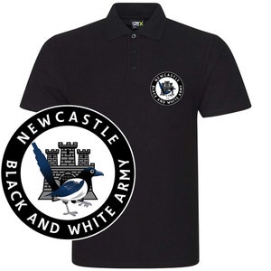 May include: Black polo shirt with a white embroidered logo featuring a magpie, a castle, and the text "Newcastle Black and White Army".