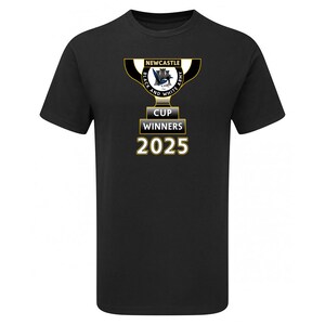 May include: Black t-shirt with a gold trophy design. The text reads "Newcastle", "Black and White Army", and "Cup Winners 2025". The trophy has a black and white crest. The shirt is made of a soft material.