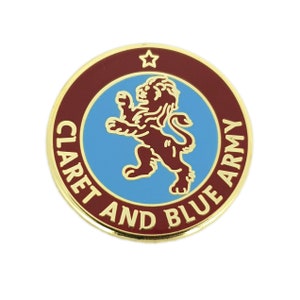 May include: A gold-coloured pin with a maroon and blue circle. The circle has a gold star at the top and the words "CLARET AND BLUE ARMY" around the edge. Inside the circle is a maroon lion.
