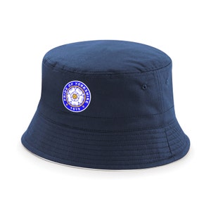 May include: A navy blue bucket hat with a white rose and the text "Pride of Yorkshire 1919" embroidered on the front.