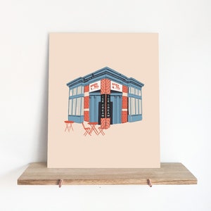May include: A digital illustration of a blue and red brick building with a sign that reads "Simple Pleasures" and "Ice Cream". There are two red tables and chairs in front of the building.