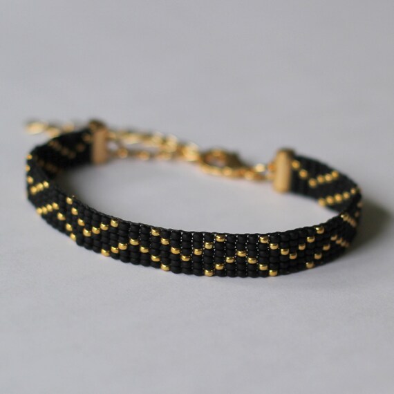 Items similar to Bracelet, woven, black gold on Etsy