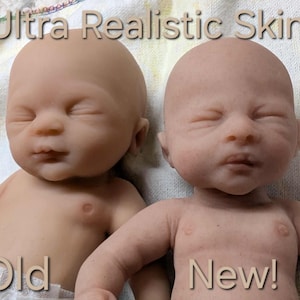 May include: Two baby dolls with closed eyes and smooth skin. The doll on the left is labeled Old and has a uniform light skin tone. The doll on the right is labeled New and features detailed, textured skin with subtle color variations. Text reads Ultra Realistic Skin!