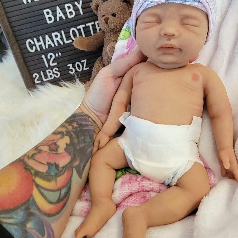 Realistic Silicone Baby Girl Doll in Green Daisy Dress with Hat – Soft Touch Collectible main image 1