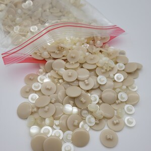 1 lb of plastic vintage buttons - 2 styles mixed, pearl white and beige - great for crafts or displayed in a jar