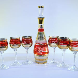 Mid-Century Czech Bohemian Barware Set. Liquor Decanter and Six Wine Glasses. Gold Rimmed Cranberry Cut to Clear Crystal. Vintage.