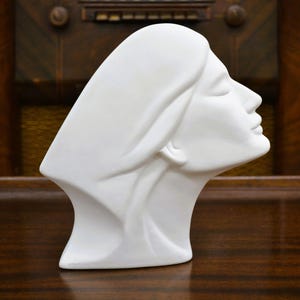 Ceramic Sculpture of Stylized Female Head. White Matte Ceramic or Porcelain Based Composite Material. Hollow Inside. Unsigned.