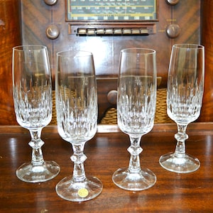 Set of Four Crystal Fluted Champagne Glasses. Produced by Schott-Zwiesel, Germany.  Flamengo Pattern. Original Sticker.