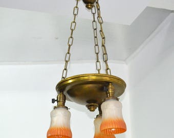 Antique Brass Pan Style Chandelier. Three Hanging Lights. Three Original Pressed Glass Shades. Made in USA in the  1910s-1930s.