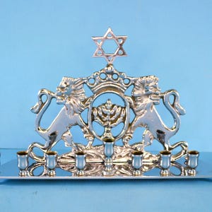 Modern Copy of East European Bench Style Menorah for Hannukah with Lions of Judea. Stainless Steel, or Silver Tone Finish on Base Metal.