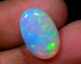 AAA Galaxy Fire Ethiopische opaal cabochon, ovale welo-edelsteen (afmeting 15,8 x 10,4 x 3,8 mm 3,75 kt)