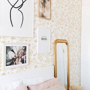 Warm toned wallpaper in a feminine pastel toned bedroom