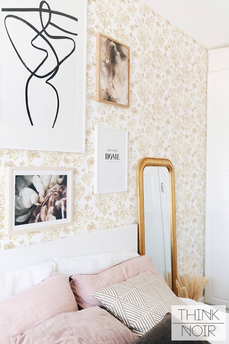 Warm toned wallpaper in a feminine pastel toned bedroom