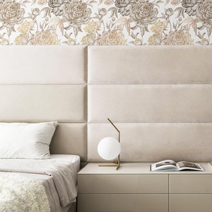 Bedroom in neutral colors with a large peony pattern wallpaper in the background.