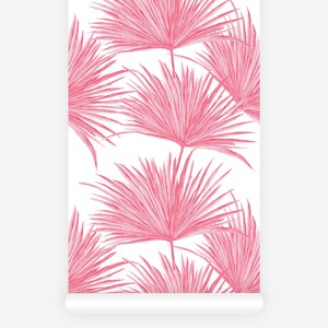 Tropical leaf print wallpaper in a vibrant pink color
