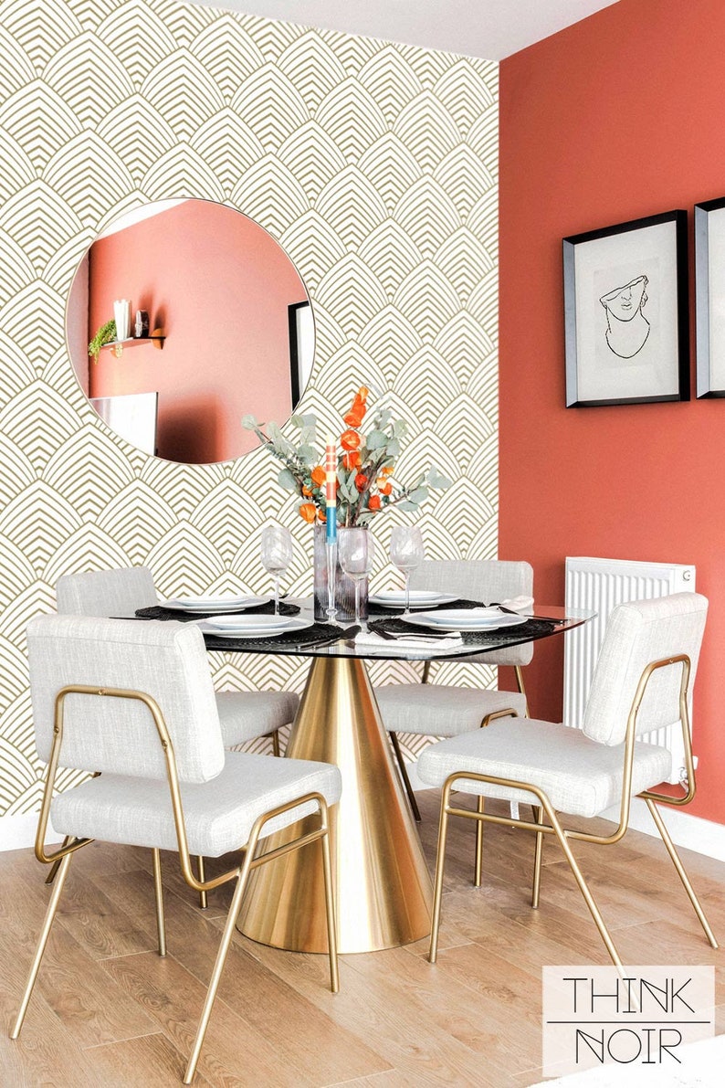 Eclectic dining room interior with a wallpapered accent wall in a geometrical art deco inspired pattern.