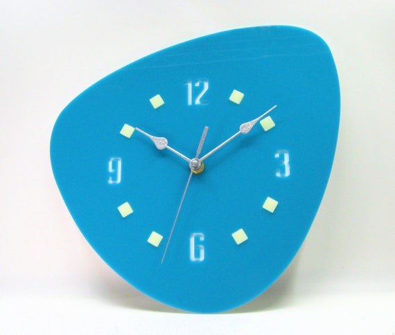 A laser-cut atomic-era starburst wall clock handmade in the USA — the Sputnik aesthetic at its purest, a genuine conversation piece.