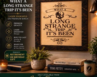 May include: A square wooden wall sign with a dark stained frame and a light birch center panel. The sign features laser-engraved black text that reads: A TIMELESS REMINDER WHAT A LONG STRANGE TRIP IT'S BEEN, accompanied by a skull and yin-yang graphic.