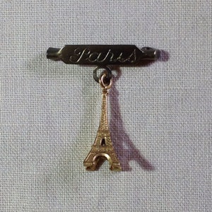 Vintage Paris and Eiffel Tower souvenir brooch in yellow metal