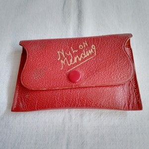 Nylon mending kit in red leather pouch
