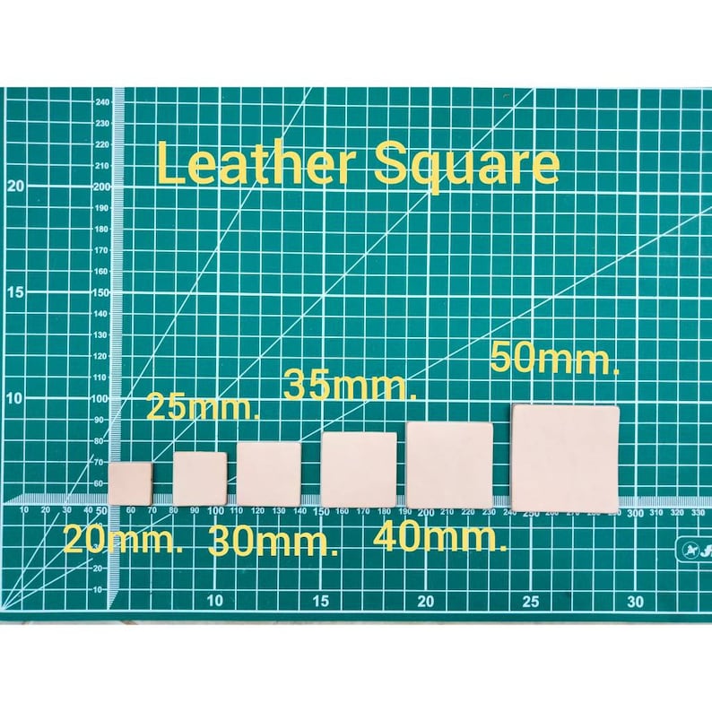 May include: Five leather squares of different sizes on a green cutting mat. The squares measure 20mm, 30mm, 40mm, 35mm, and 50mm.