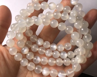 Filo di perle di pietra di luna naturale cangiante bianco latte da 7 mm, screpolate e opache, lunghezza 7 pollici.
