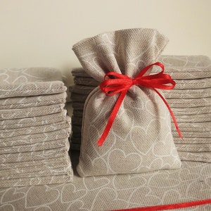 Sacchettino, tessuto, fatto a mano, segna posto, ricordo, rosso, cuore, fiocco, bianco, San Valentino, Laurea, Battesimo, Matrimonio, nozze