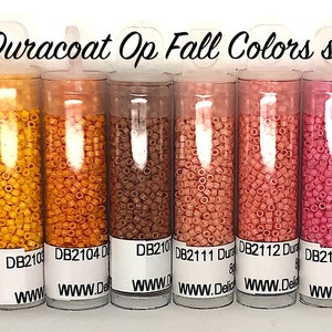 May include: A set of ten small tubes containing 8 grams each of Delica Duracoat opaque seed beads in fall colors. The colors range from pale yellow to deep red. The tubes are labeled with the bead color code and the website address www.DelicaBeadsShop.com.