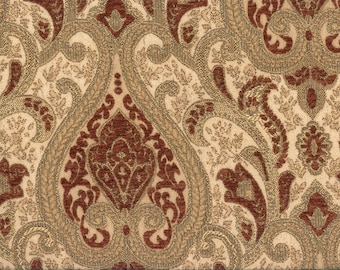 Puede incluir: Una tela con un patrón de paisley en tonos marrones, dorados y rojos.