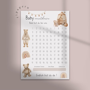 Könnte beinhalten: Ein weißes Poster mit der Überschrift Baby countdown und dem Text Bald bist du bei uns, das ein nummeriertes Raster von 1 bis 100, Illustrationen von zwei Teddybären, zwei Regenbögen und einer Kinderzimmerszene mit Wiege und Stuhl zeigt.