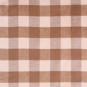 May include: A close-up shot of a brown and cream-colored checkered fabric. The pattern consists of evenly spaced squares, creating a classic gingham design. The fabric appears to be soft and textured, suitable for various craft projects or home decor.