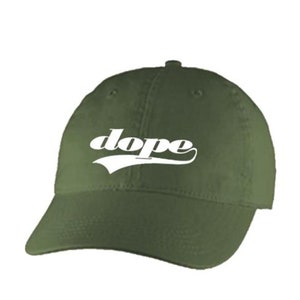 May include: A green baseball cap with a white "dope" logo in a retro font.