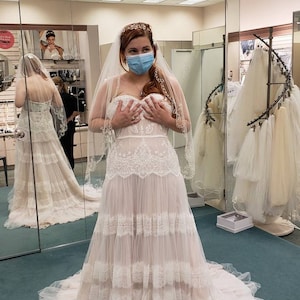 banded lace point d'esprit tulle wedding dress Discover the beauty behind bridal design From structured guipure to delicate point d'esprit, we're breaking down 12 different types of wedding dress lace and how each one transforms a gown. Perfect
