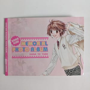 May include: A pink "Hana Kimi Memorial Photo Album" featuring a manga-style illustration of a person in a school uniform. The album cover displays the text "Hana Kimi Memorial Photo Album" and "Hana to Yume".