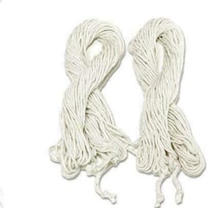 May include: Two bundles of white cotton string, each tied in a knot at the end.