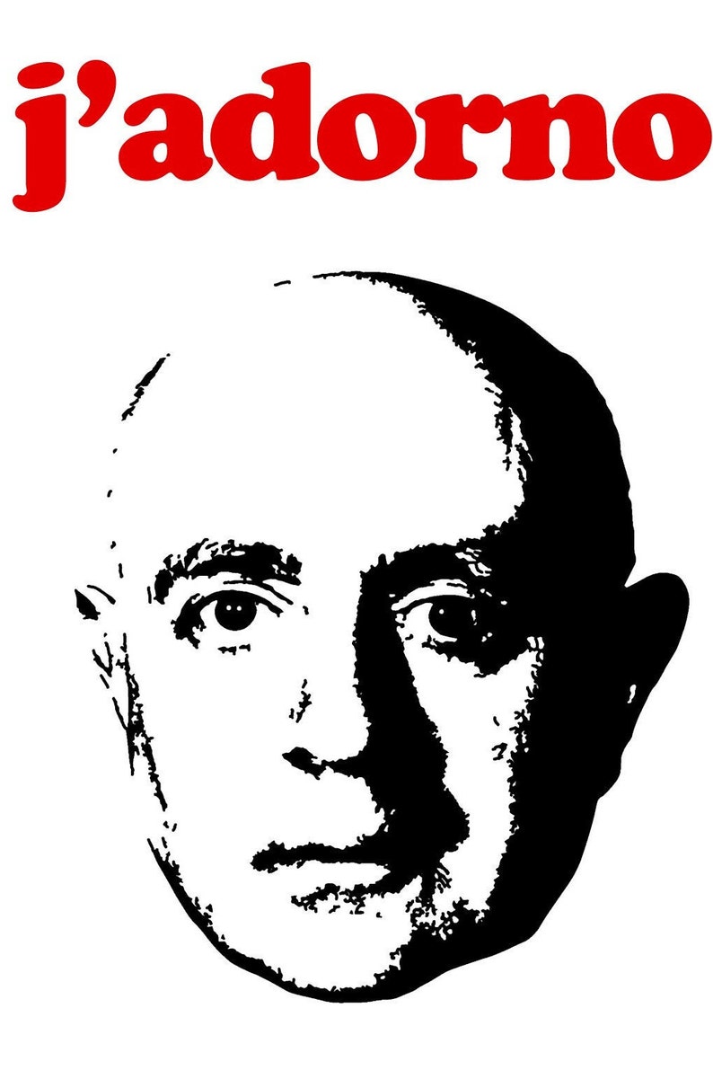 May include: Black and white silhouette of a man's face with the text "j'adorno" in red letters above the image.