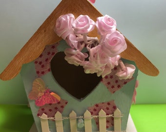 Quirky hand decorated birdhouse