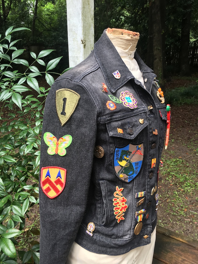 vintage patches pins and jewelry assemblage upcycled JEAN JACKET with antique needlework flowers
