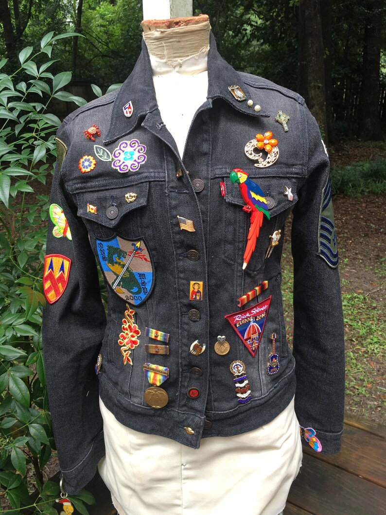 vintage patches pins and jewelry assemblage upcycled JEAN JACKET with antique needlework flowers